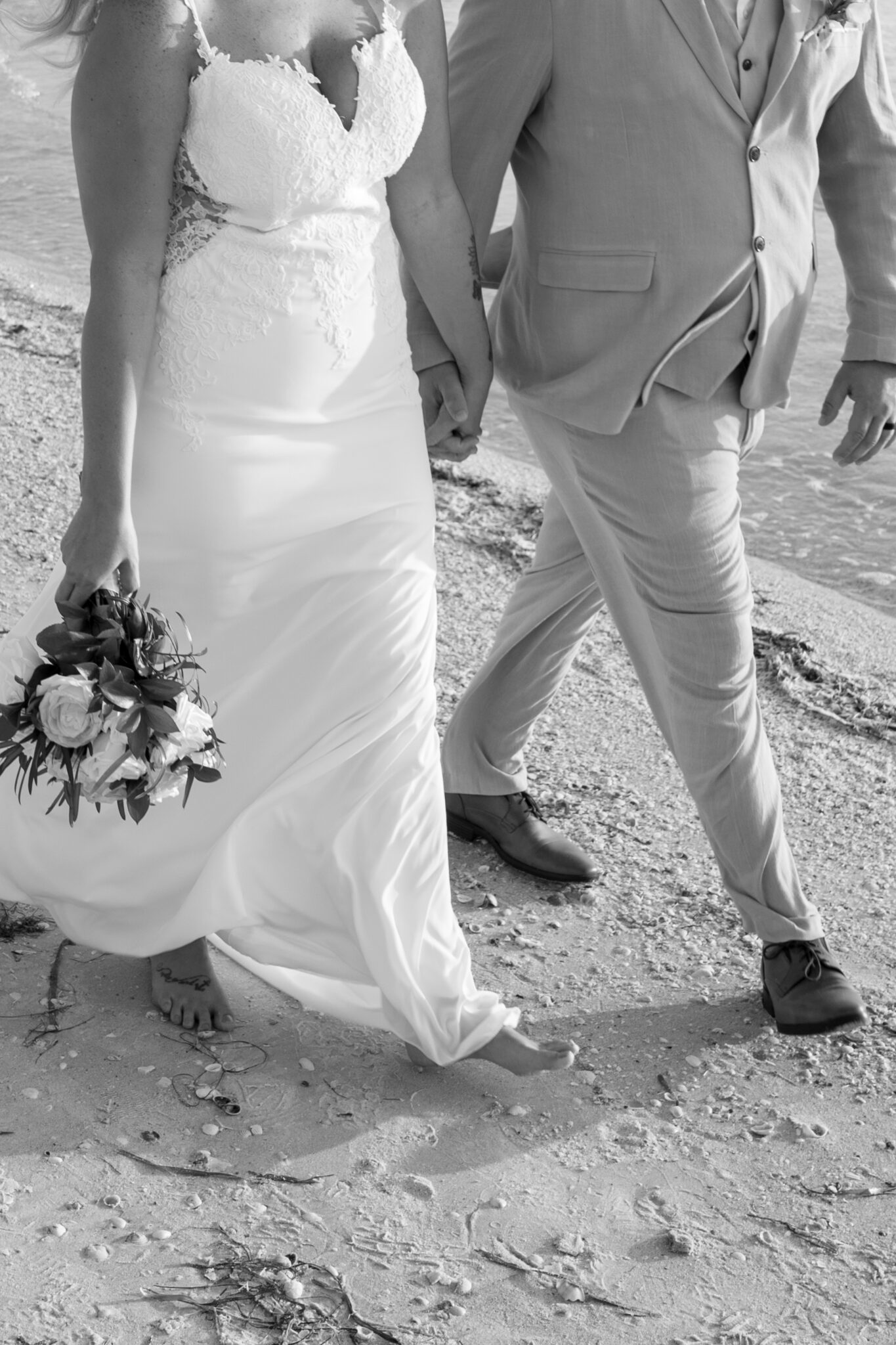 Beach wedding photos by the water