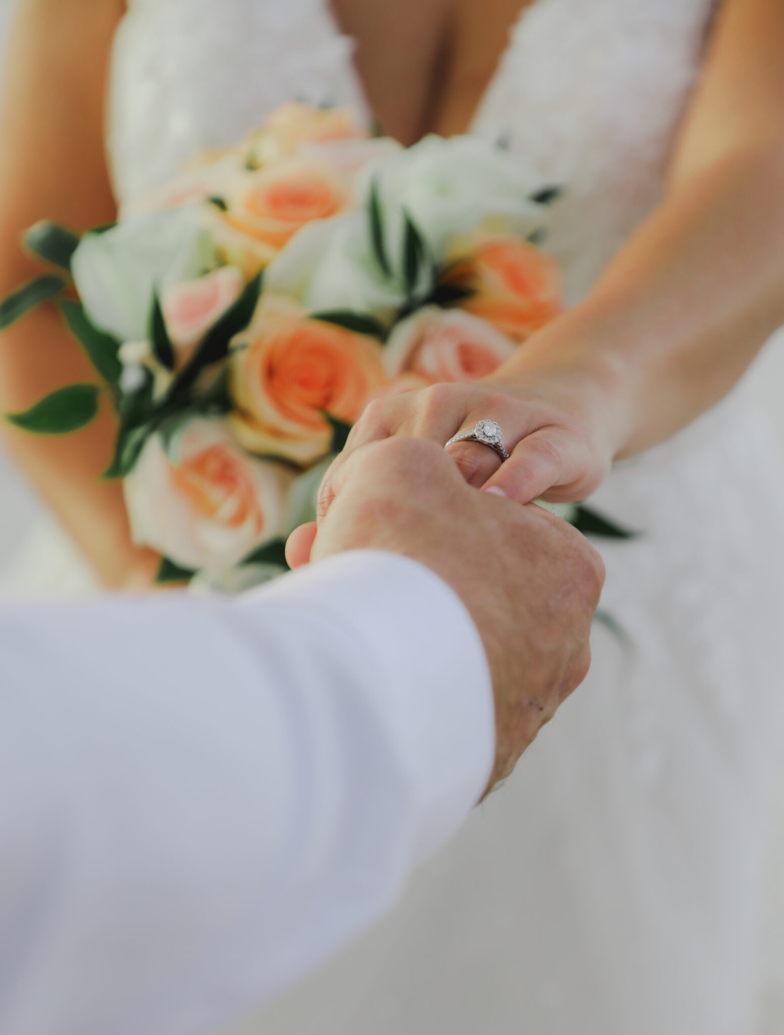 Bride and groom holding hands