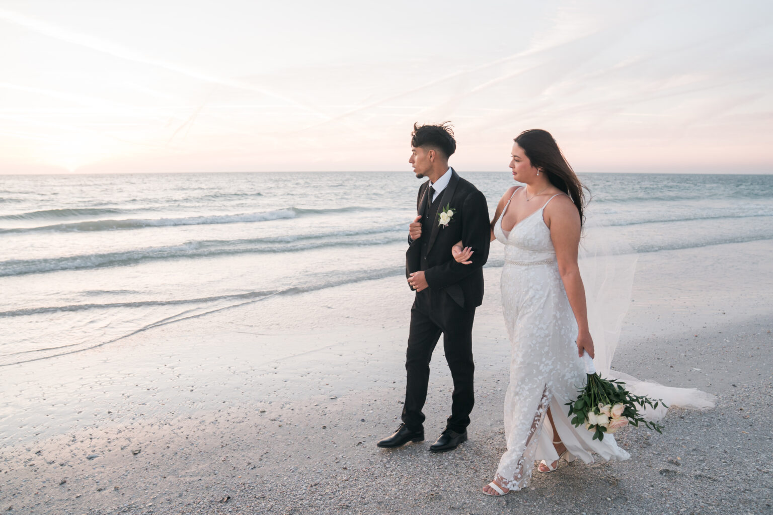 Couple walking down the beach